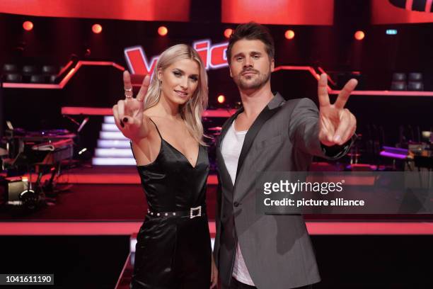 September 2018, Berlin: Moderators Lena Gercke and Thore Sch·lermann at the photocall of "The Voice of Germany". On 18 October 2018 the show starts...