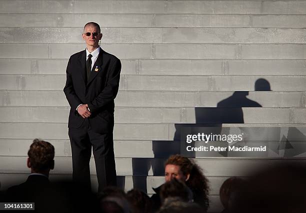 Papal security officer stands near the stage as Pope Benedict XVI conducts Mass at Bellahouston Park on September 16, 2010 in Glasgow, Scotland. Pope...