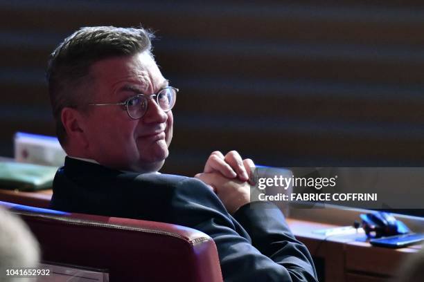 German Football Association president Reinhard Grindel looks on as he waits for the announcement of the country which will host the Euro 2024 fooball...