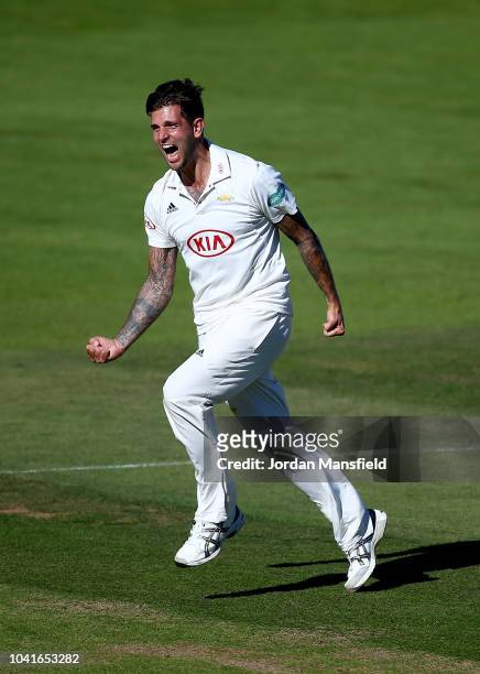 Jade Dernbach of Surrey celebrates dismissing Tom Westley of Essex during day three of the Specsavers County Championship Division One match between...