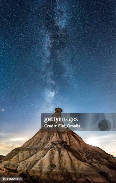 cabezo de castildetierra in las bardenas reales desert at night with milky way - navarra stock pictures, royalty-free photos & images