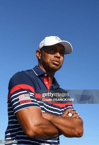 Golfer Tiger Woods looks on during a practice session ahead of the 42nd Ryder Cup at Le Golf National Course at Saint-Quentin-en-Yvelines, south-west...