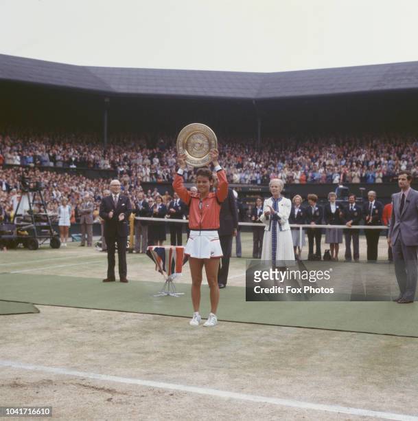 Australian tennis player Evonne Goolagong Cawley wins the Wimbledon Ladies Singles trophy, 4th July 1980. Behind her and to the right is the Duchess...