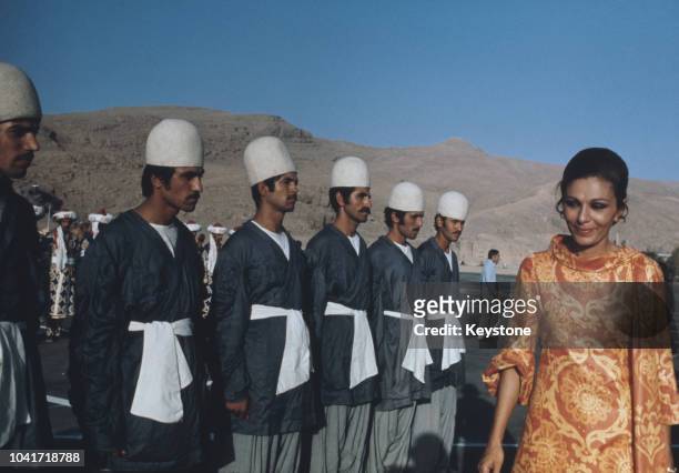 Empress Farah Pahlavi of Iran, the consort of the Shah of Iran, inspects troops during preparations for the anniversary celebrations of the founding...