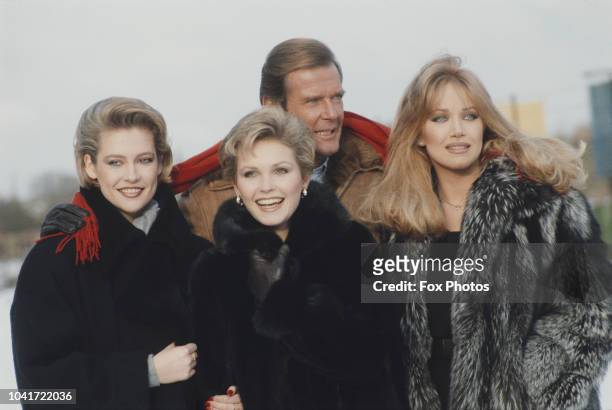 From left to right, actors Alison Doody, Fiona Fullerton, Roger Moore and Tanya Roberts pose at Pinewood Studios in England, to promote the new James...