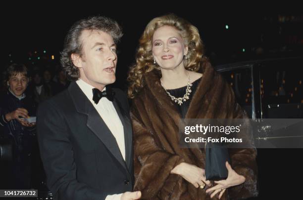 American actress Faye Dunaway attends the premiere of the film 'The Wicked Lady' in Leicester Square, London, accompanied by her husband,...