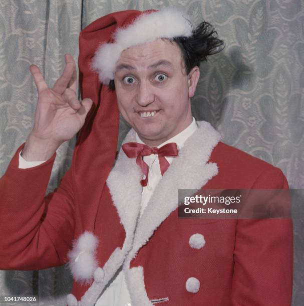 English comedian Ken Dodd wearing a Santa Claus outfit at the Royal Court Theatre in Liverpool, UK, circa 1972.