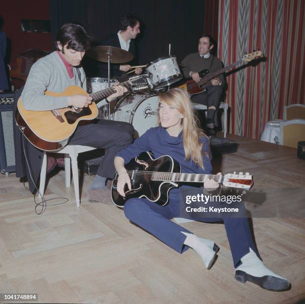 French singer and songwriter Francoise Hardy performs at the Savoy Hotel in London, UK, 1967.