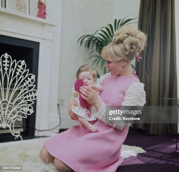 English actress Julia Foster with her infant daughter Emily-Jane, 1968.