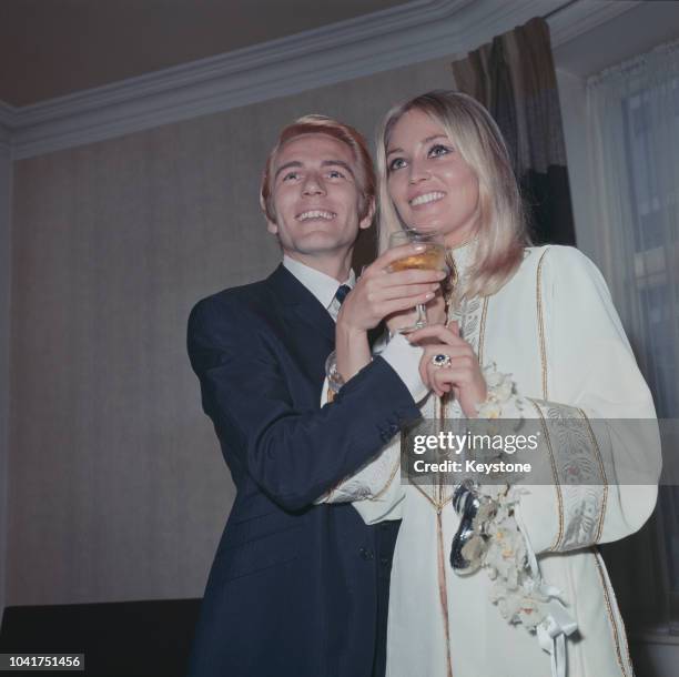 English pop singer Adam Faith with his wife Jackie Irving after their wedding at Caxton Hall registry office in London, 19th August 1967.