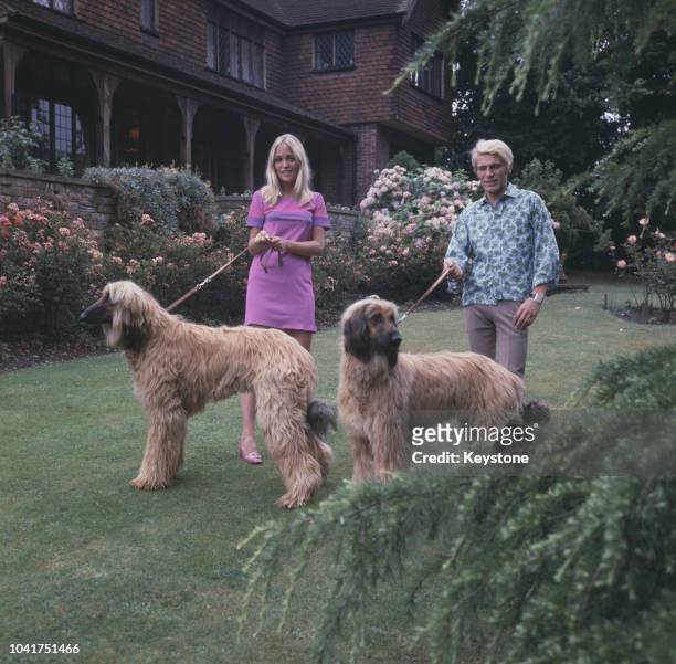 English pop singer Adam Faith at home with his wife Jackie, circa 1970.