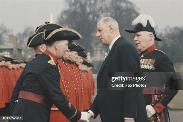 French President Charles de Gaulle meets a line of Chelsea Pensioners during a State Visit to London, April 1960.