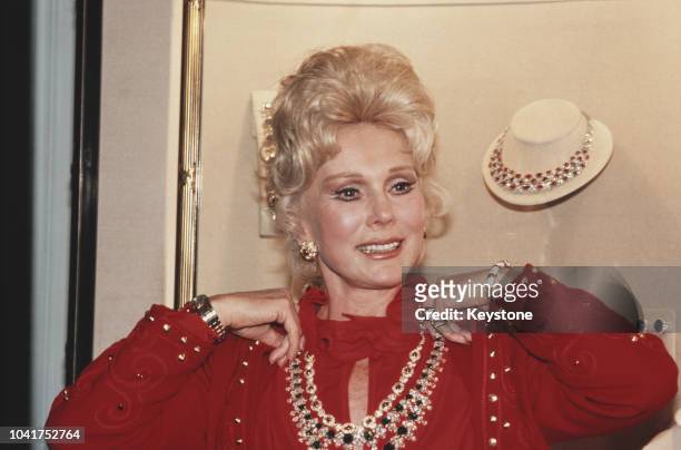 Hungarian-born actress Eva Gabor modelling jewellery by Harry Winston on the eve of the 'Night of 100 Stars', circa 1982.
