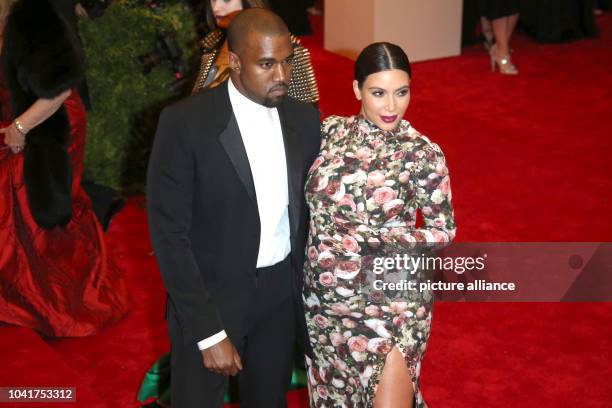 Kim Kardashian and Kanye West arrive at the Costume Institute Gala for the "Punk: Chaos to Couture" exhibition at the Metropolitan Museum of Art in...