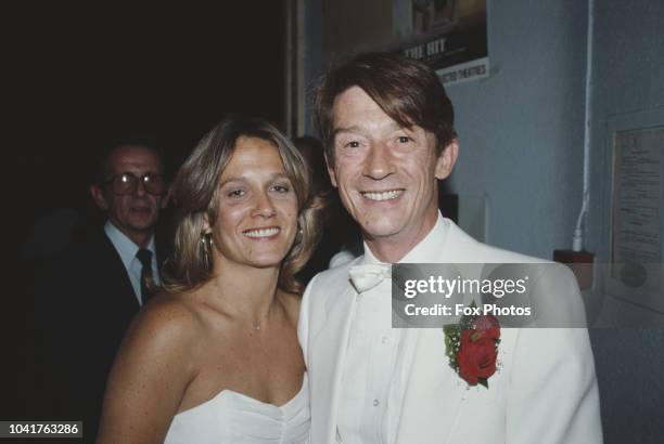 English actor John Hurt with his wife Donna at the premiere of the film 'The Hit', 1984. Hurt stars in the film, which was directed by Stephen Frears.