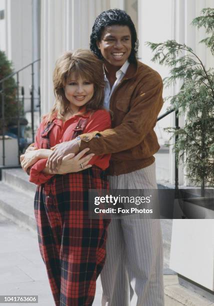 American singer Jermaine Jackson with actress and singer Pia Zadora at the Belfry Club in London, to promote their new single 'When the Rain Begins...