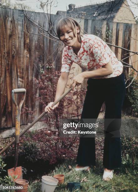 British actress Glenda Jackson does some work in the garden, circa 1970.