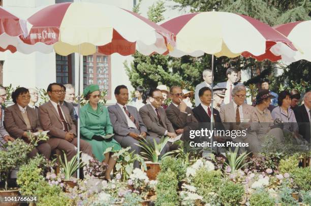 Queen Elizabeth II, Prince Philip and British Foreign Secretary Geoffrey Howe in Kunming during their tour of China, October 1986.