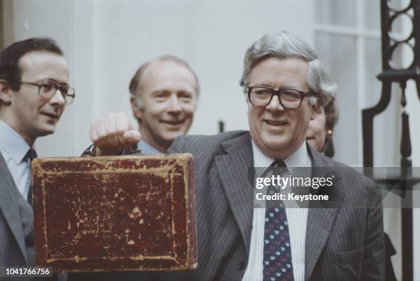 British Conservative politician Sir Geoffrey Howe , Chancellor of the Exchequer, with the budget box on Budget Day, London, UK, 15th March 1983.
