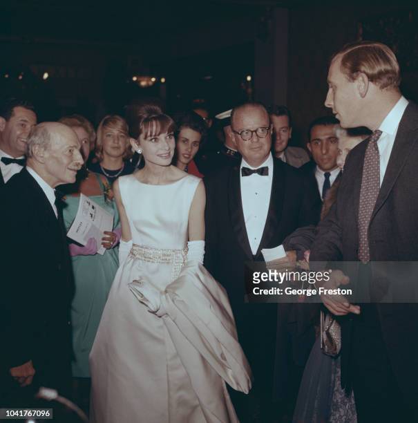 From left to right, former British Prime Minister Lord Attlee , actress Audrey Hepburn , and George Weltner of Paramount Pictures, at a charity...