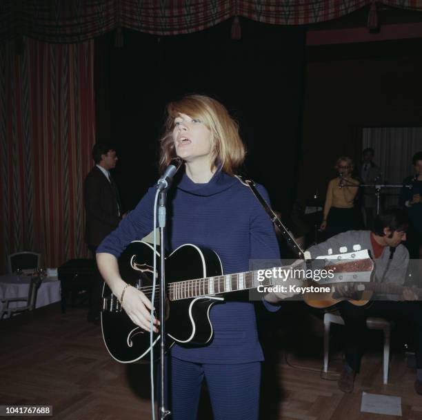 French singer and songwriter Francoise Hardy performs at the Savoy Hotel in London, UK, 1967.