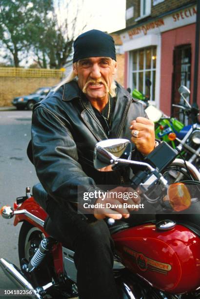 Hulk Hogan poses on a motorcycle at Warr's Harley-Davidson, June 1994, in London, England.