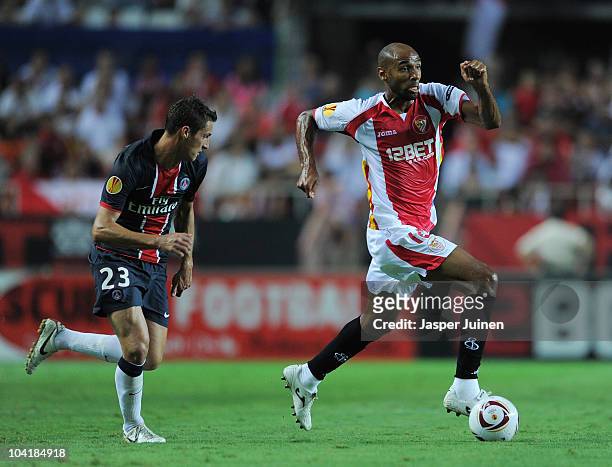 Frederic Kanoute of Sevilla runs for the ball with Jeremy Clement of Paris Saint Germain during the UEFA Europa League group J match between Sevilla...