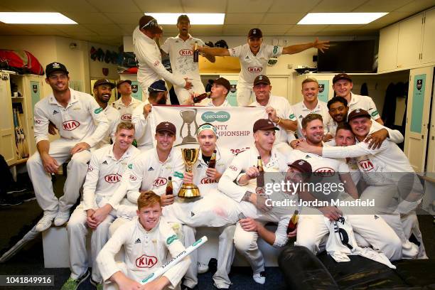 Surrey Captain Rory Burns celebrates with his teammates after winning the Specsavers County Championship during day four of the Specsavers County...