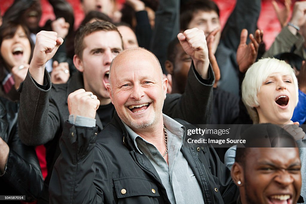 Happy man at football match