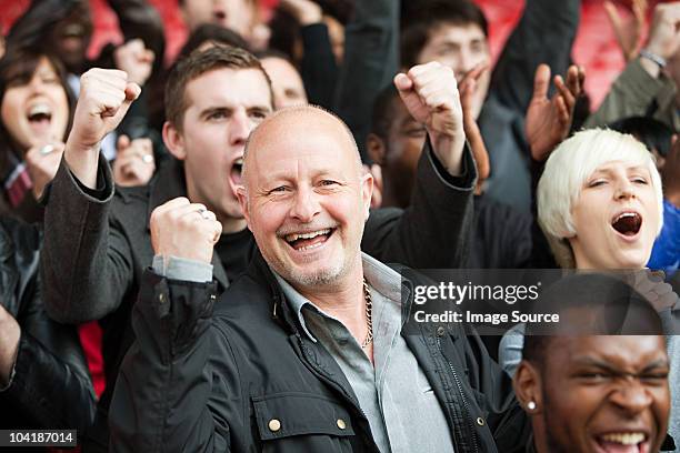 happy man at football match - sports fan stock pictures, royalty-free photos & images