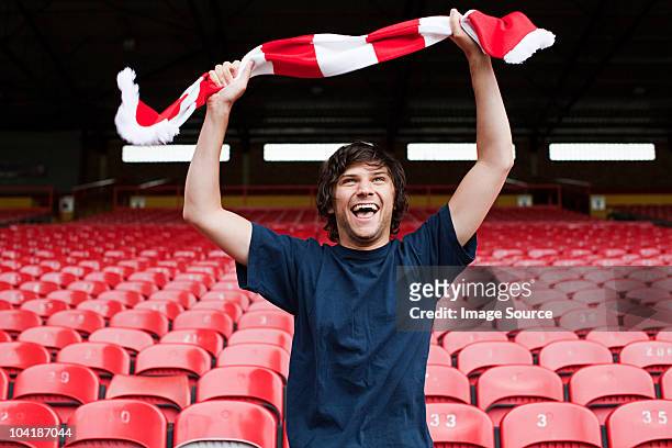 happy football fan in empty stadium - fan enthusiast stock pictures, royalty-free photos & images