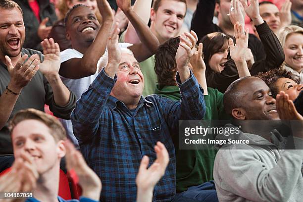 fans cheering - crowd cheering stock pictures, royalty-free photos & images