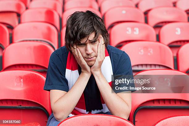 Disappointed Football Fan In Empty Stadium, 照片檔