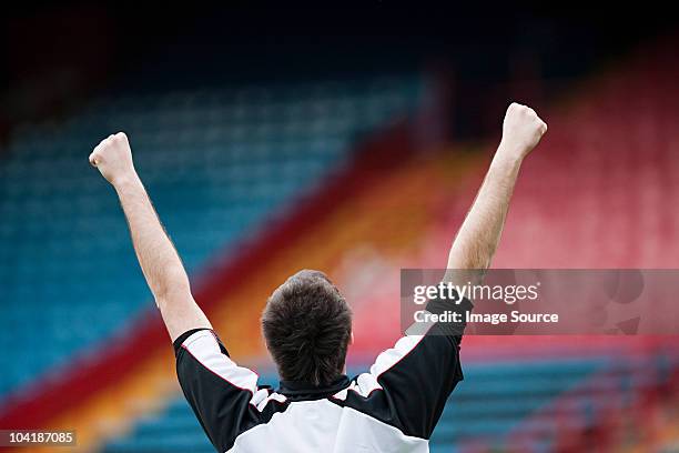 footballer punching the air - yes stockfoto's en -beelden