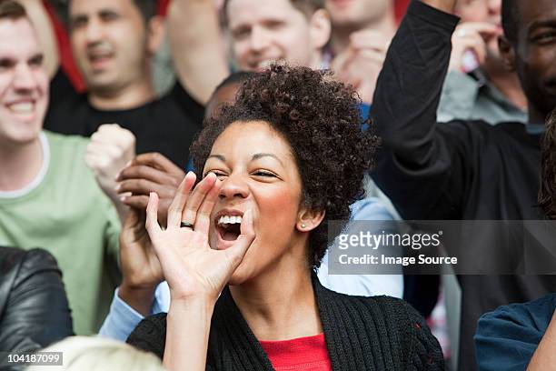 shouting woman at football match - crowd cheering stock pictures, royalty-free photos & images