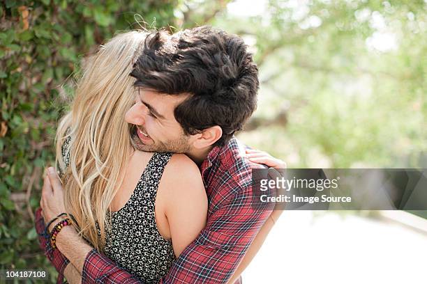 affectionate young couple on vacation - hollywood couples stock pictures, royalty-free photos & images