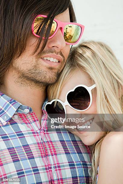 young couple wearing sunglasses - hollywood couples stock pictures, royalty-free photos & images