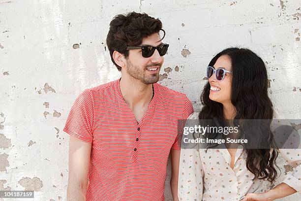 affectionate young couple on vacation - hollywood couples stock pictures, royalty-free photos & images