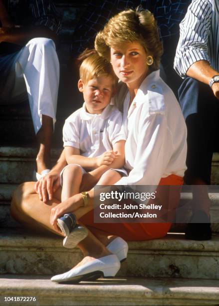 Charles, Prince of Wales, and Diana, Princess of Wales, on holiday in Majorca, Spain, with their sons Prince William and Prince Harry, They are...