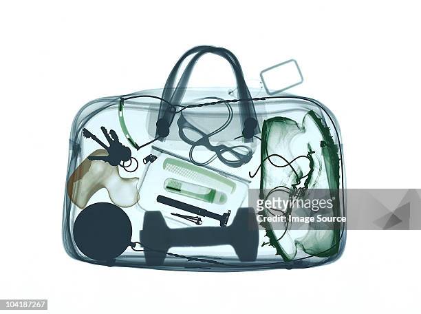 xray image of bag containing sports equipment - airport x ray images stock-fotos und bilder
