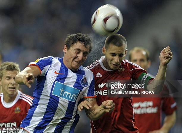 Porto's midfielder Cristian Rodriguez from Uruguay heads the ball as he vies with Rapid Vienna's midfielder Stefan Kulovits during their UEFA Europa...