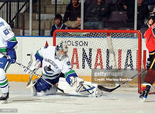 Eddie Lack of the Vancouver Canucks makes a save against the Calgary Flames during Game Seven of the Young Stars Tournament at the South Okanagan...