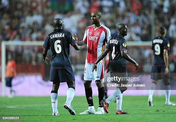 Frederic Kanoute of Sevilla greets his fellow countrymen Zoumana Camara and Claude Makelele of Paris Saint Germain at the end of the UEFA Europa...