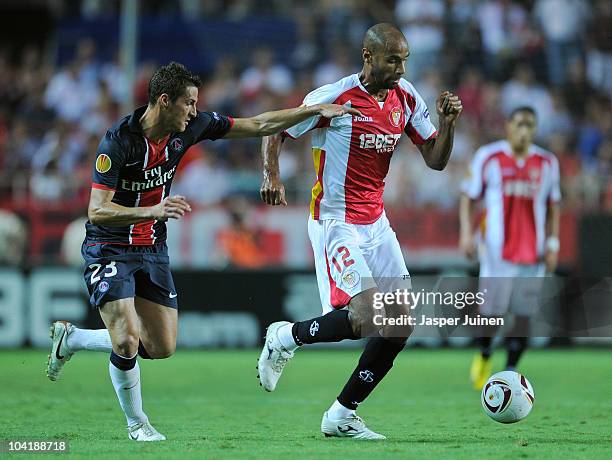 Frederic Kanoute of Sevilla duels for the ball with Jeremy Clement of Paris Saint Germain during the UEFA Europa League group J match between Sevilla...