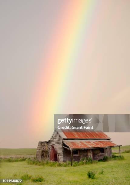 a rainbow over an abandoned farmhouse. - farmhouse stock pictures, royalty-free photos & images