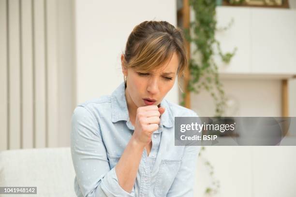 Woman coughing.