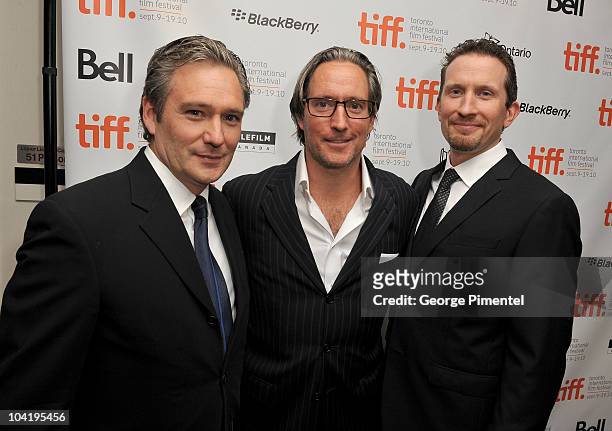 Webster Stone, Rob Stone and producer Brian Peter Falk arrive at "The Conspirator" Premiere held at Roy Thomson Hall during the 35th Toronto...
