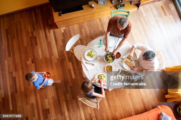 lgbtq family eating together - people sitting around table top view stock pictures, royalty-free photos & images
