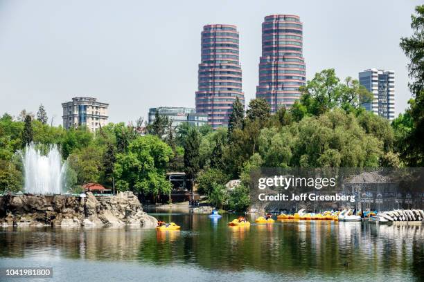 Paddleboats on the lake at Bosque de Chapultepec forest park.