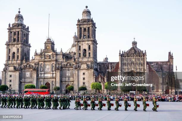 Soldiers on a military parade outside the Metropolitan Cathedral at the Plaza de la Constitucion Constitution Zocalo, flag lowering ceremony.